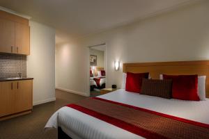 Postel nebo postele na pokoji v ubytování BEST WESTERN PLUS Travel Inn