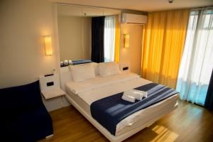Postel nebo postele na pokoji v ubytování VIP APARTmENTS N9