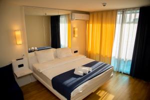 Postel nebo postele na pokoji v ubytování VIP APARTmENTS N9