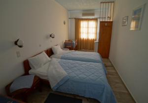 Letto o letti in una camera di Nefeli Hotel