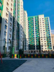 a group of tall buildings in a city at In the central of Ulaanbaatar, Selbe Comfort Apartment, 9f 187 in Ulaanbaatar
