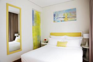 Ліжко або ліжка в номері Palmier Hotel - Art House Da Nang