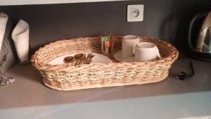 a wicker basket sitting on a counter with toiletries at Luxuria Inn yaounde in Yaoundé