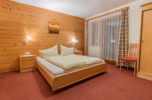 מיטה או מיטות בחדר ב-Haus Waltraud