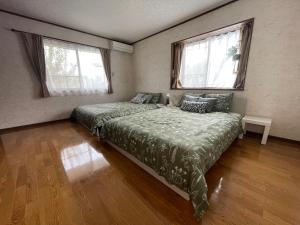 Postel nebo postele na pokoji v ubytování Slowhouse ZUSHI