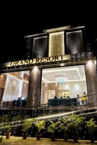 a store front of a grand resort at night at Grand Resort in Puri