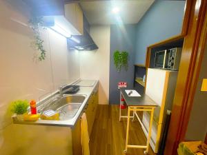 Η κουζίνα ή μικρή κουζίνα στο Otaru Retreat Come Inn - a hidden retreat house