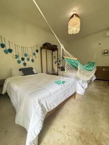 Postel nebo postele na pokoji v ubytování BACALAR INN Hotel