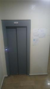 a green door in a room with a wall at single bed small room in Casablanca +6 photos