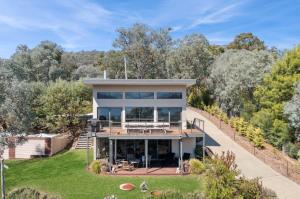 an aerial view of a house with a deck at The Point Lakehouse Taylor Bay in Eildon