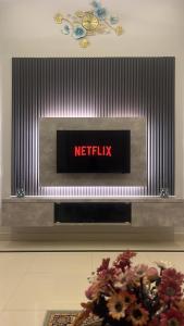 a netflix sign on a wall in a building at 4bhk Luxury Villa in Mangalore