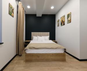 Postel nebo postele na pokoji v ubytování Gardeni Guest House