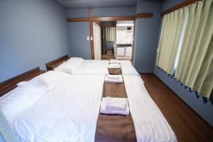 Postel nebo postele na pokoji v ubytování Mitomi inn