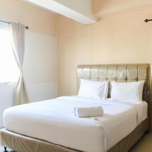 Ένα ή περισσότερα κρεβάτια σε δωμάτιο στο Comfy 2BR Apartment at Park View Condominium By Travelio