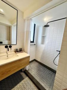a bathroom with a sink and a shower at Rio Royale in Candolim +40 photos