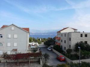 a view of a street in a city with buildings at Apartment Roksy - Two-Bedroom Apartment with Terrace and Sea View ST in Supetar