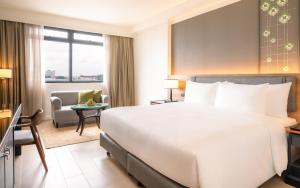 Кровать или кровати в номере Dusit Princess Chiang Mai +38 фотографий