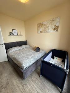 a small bedroom with a bed in a room at Il Sogno terrazza panoramica in Massino Visconti