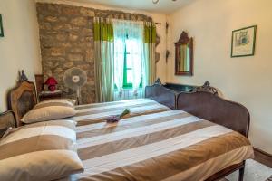 Кровать или кровати в номере Rural Villas Crikvenica