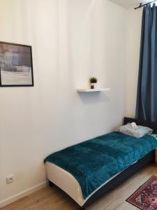 Ένα ή περισσότερα κρεβάτια σε δωμάτιο στο Centrum 5a Próchnika 21