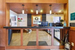 an office lobby with a large counter in the middle at Quality Inn & Suites in Dawsonville +89 photos