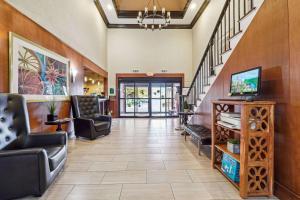 a lobby with chairs and stairs in a hospital at Quality Inn & Suites in Dawsonville