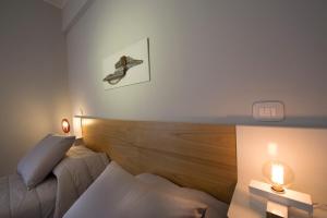 Postel nebo postele na pokoji v ubytování Ciauru Design B&B