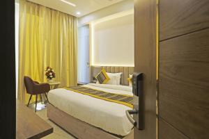 Postel nebo postele na pokoji v ubytování Hotel Mehul International -New Delhi City Center + 37 fotografií
