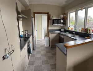 a kitchen with a sink and a counter top at Rest & Relax Units in Whangarei