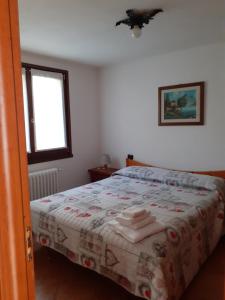 Postel nebo postele na pokoji v ubytování Casa vacanze Emilio
