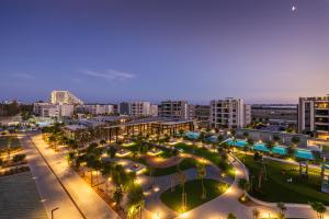 a city at night with lights and buildings at Sunset Gardens in Limassol