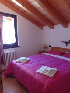 Postel nebo postele na pokoji v ubytování Casa vacanze Emilio