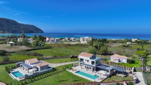 an aerial view of a house with a swimming pool at Aquamarina Villas in Lefkada Town