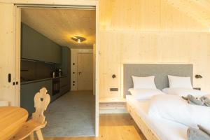 Postel nebo postele na pokoji v ubytování Appartements zi Ranna