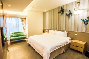 Letto o letti in una camera di Walker Hotel. Ximen