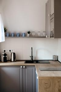 Kuchyňa alebo kuchynka v ubytovaní Adeline Apartman