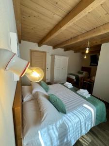 Postel nebo postele na pokoji v ubytování Rifugio San Carlo