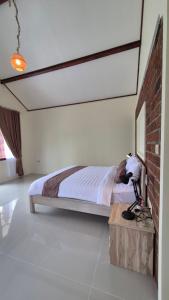 Postel nebo postele na pokoji v ubytování Rice Field inn - Lombok