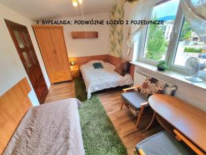Ένα ή περισσότερα κρεβάτια σε δωμάτιο στο Apartament Kacperek samo centrum, Willowa 4A - 2 sypialnie, salon - dla rodziny 4-5 os