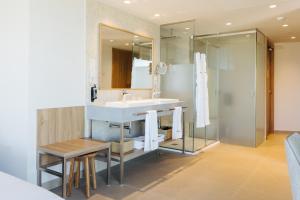 a bathroom with a sink and a shower at BANCAL HOTEL and SPA in San Sebastián de la Gomera