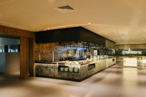 a restaurant with a buffet in the middle of a room at BANCAL HOTEL and SPA in San Sebastián de la Gomera