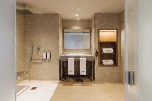 a bathroom with a sink and a mirror at BANCAL HOTEL and SPA in San Sebastián de la Gomera