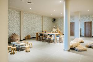 a room with a table and chairs and a dining room at BANCAL HOTEL and SPA in San Sebastián de la Gomera