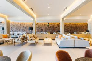 a lobby of a hotel with couches and chairs at BANCAL HOTEL and SPA in San Sebastián de la Gomera