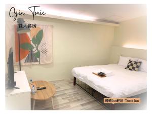 Postel nebo postele na pokoji v ubytování 轉轉lnn輕旅 Turnt Inn