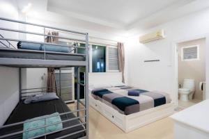 a bedroom with two bunk beds and a bathroom at City Beach 3 Pool Villa Hua Hin in Hua Hin +47 photos