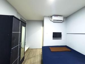 TV a/nebo společenská místnost v ubytování Beranda Istirahat Pluit