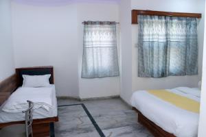Postel nebo postele na pokoji v ubytování Hotel Gush At New Delhi Railway Station + 34 fotografií