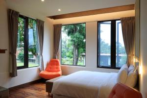 Postel nebo postele na pokoji v ubytování 大方來富莊園民宿DF Life Lodge