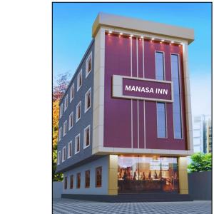a rendering of a building with a manama inn sign on it at Manasa Inn in Palakkad
